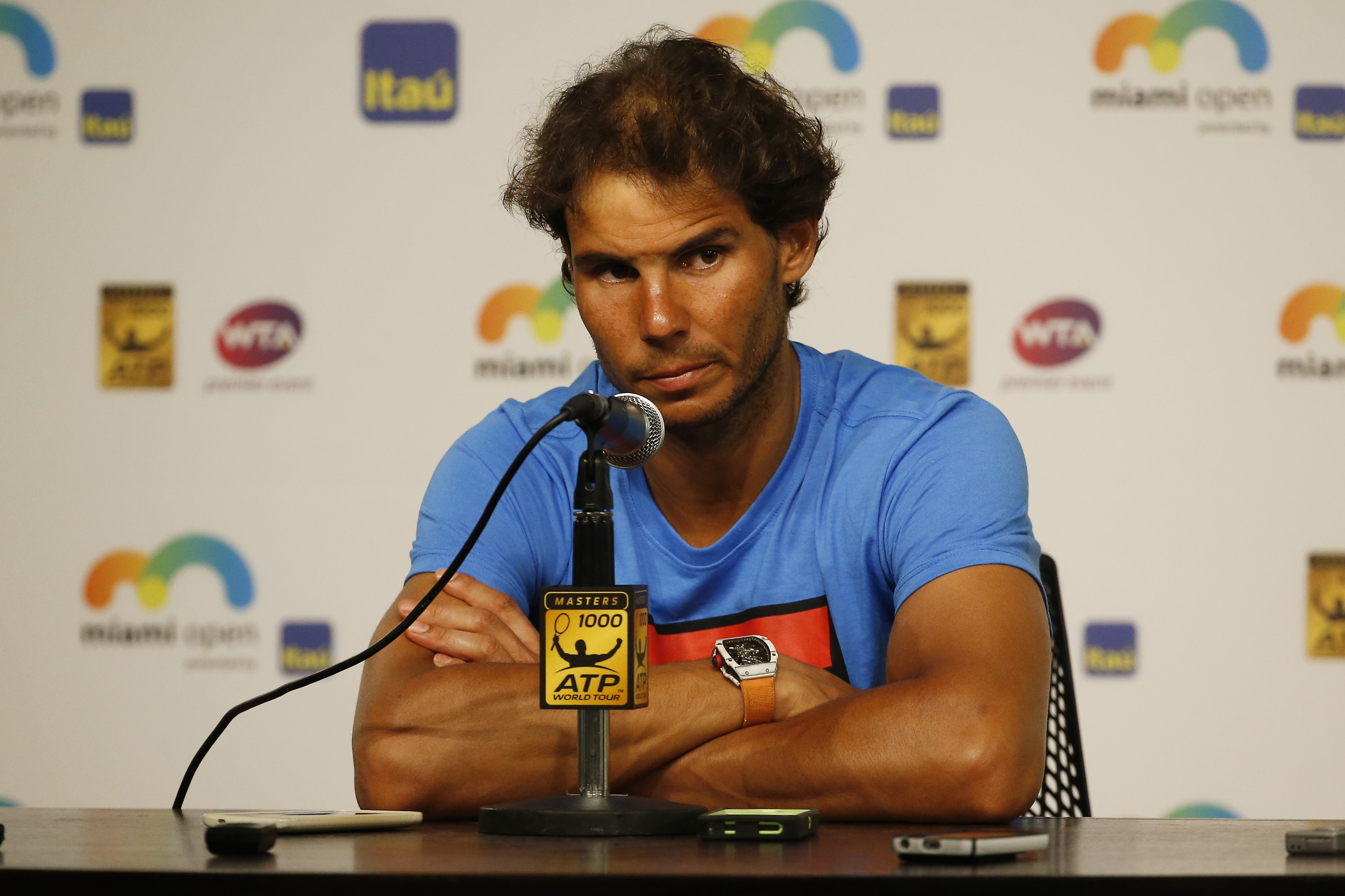 Dizzy Nadal retires in Florida heat, Murray moves on