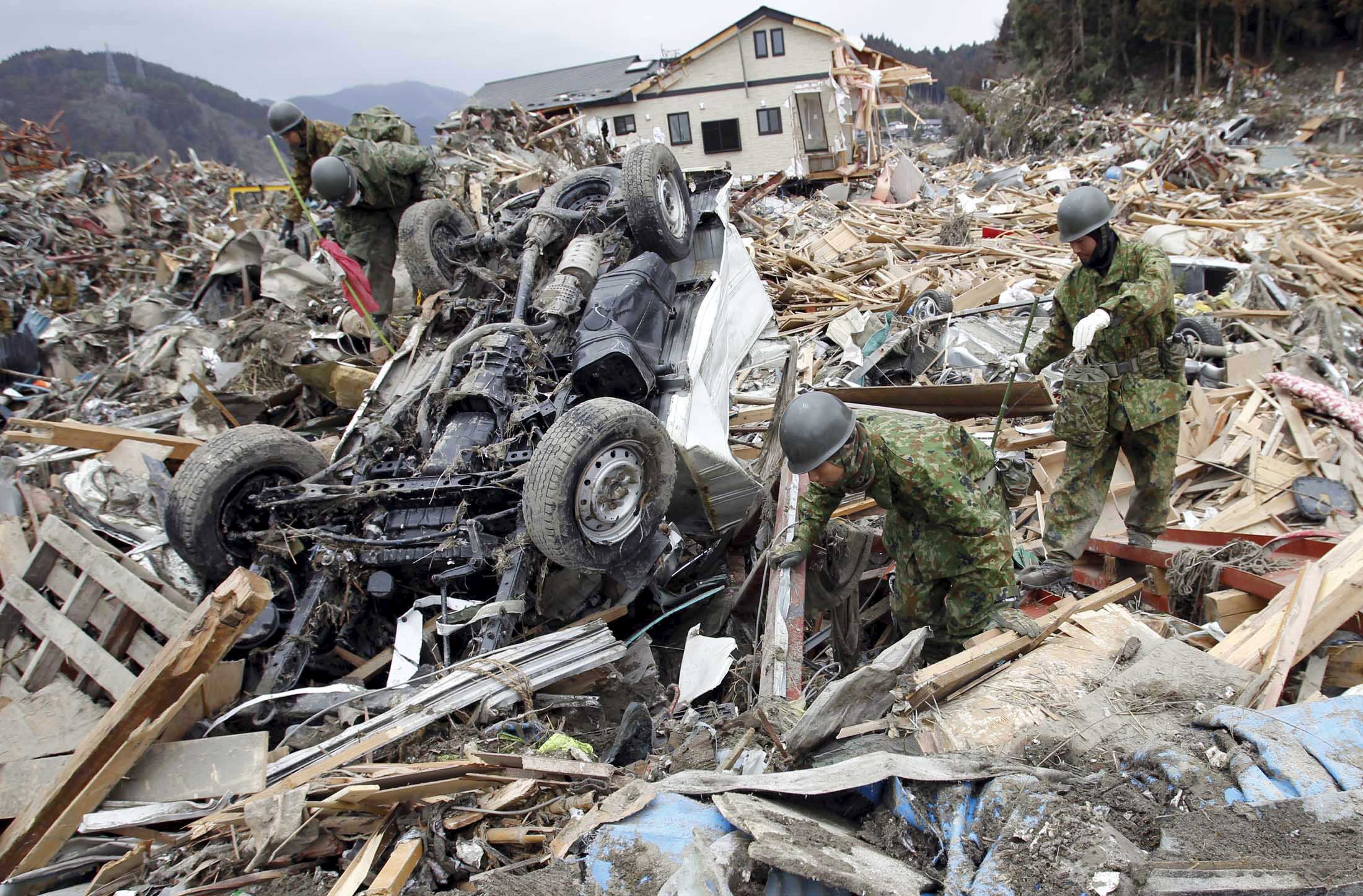 Pain lingers five years on as tsunami-hit Japan town rises from ruins
