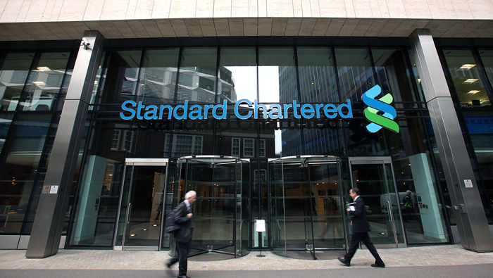 Standard Chartered chief sees depressed earnings this year