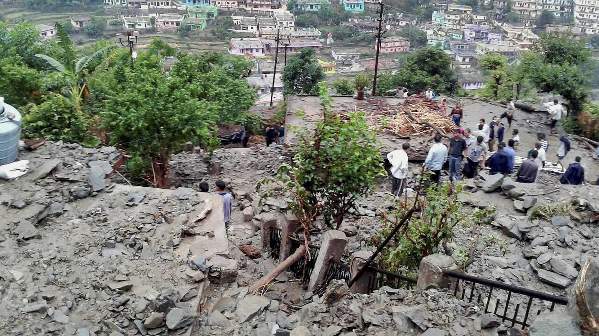 Landslides in north Indian state of Uttarakhand bury vehicles, block roads