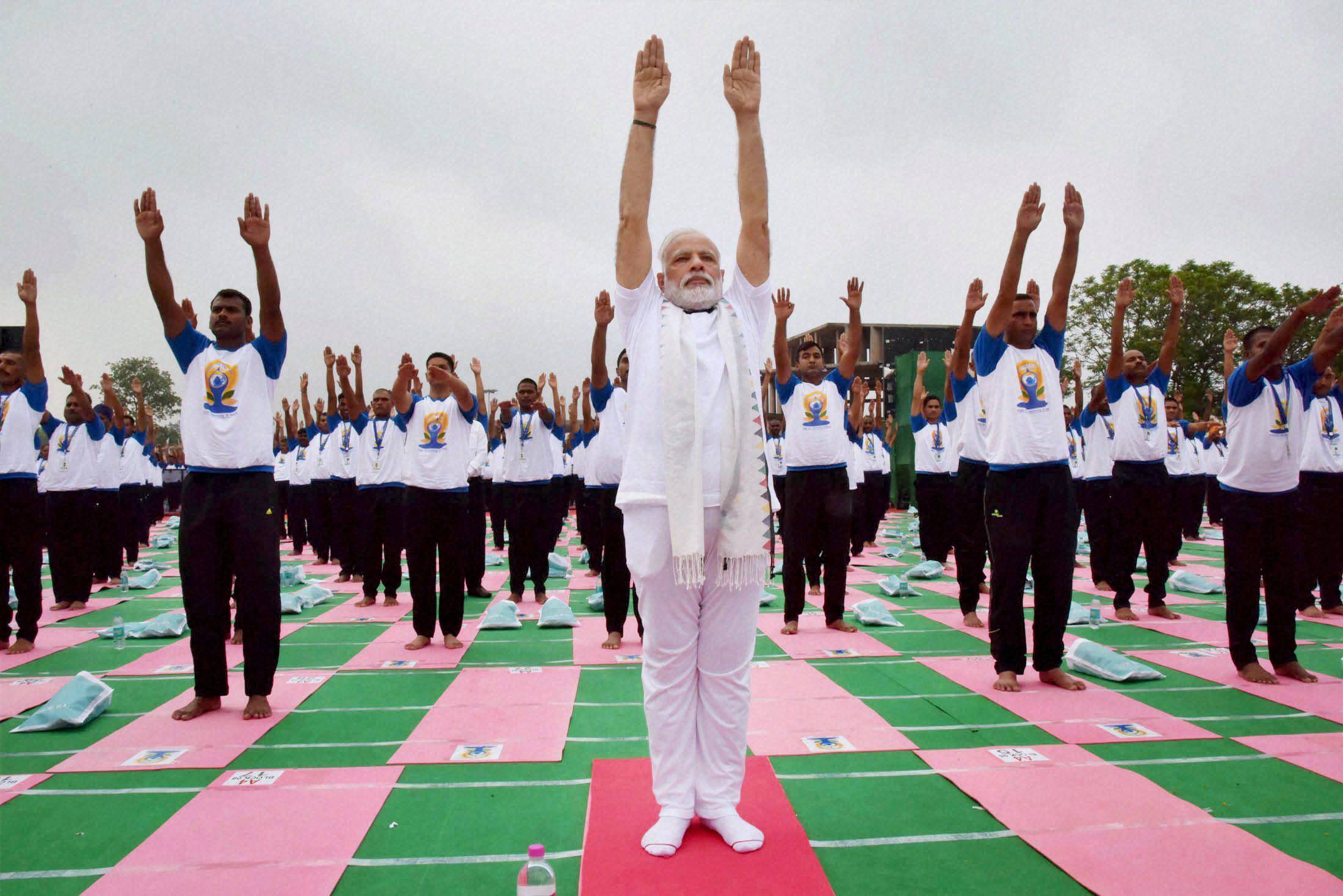 Millions stretch and bend on International Day of Yoga in India