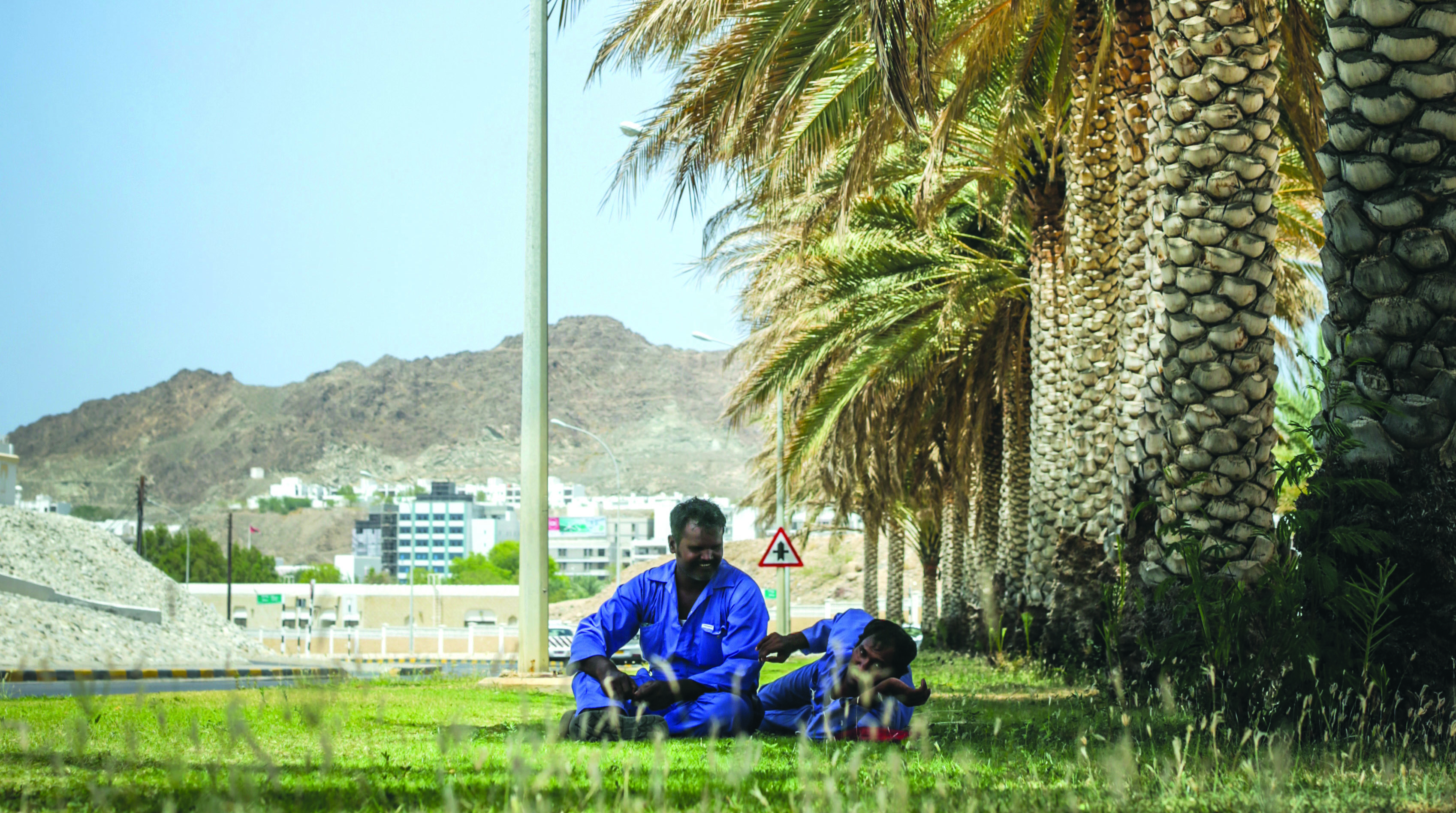 Give the workers in Oman a break in sizzling summer