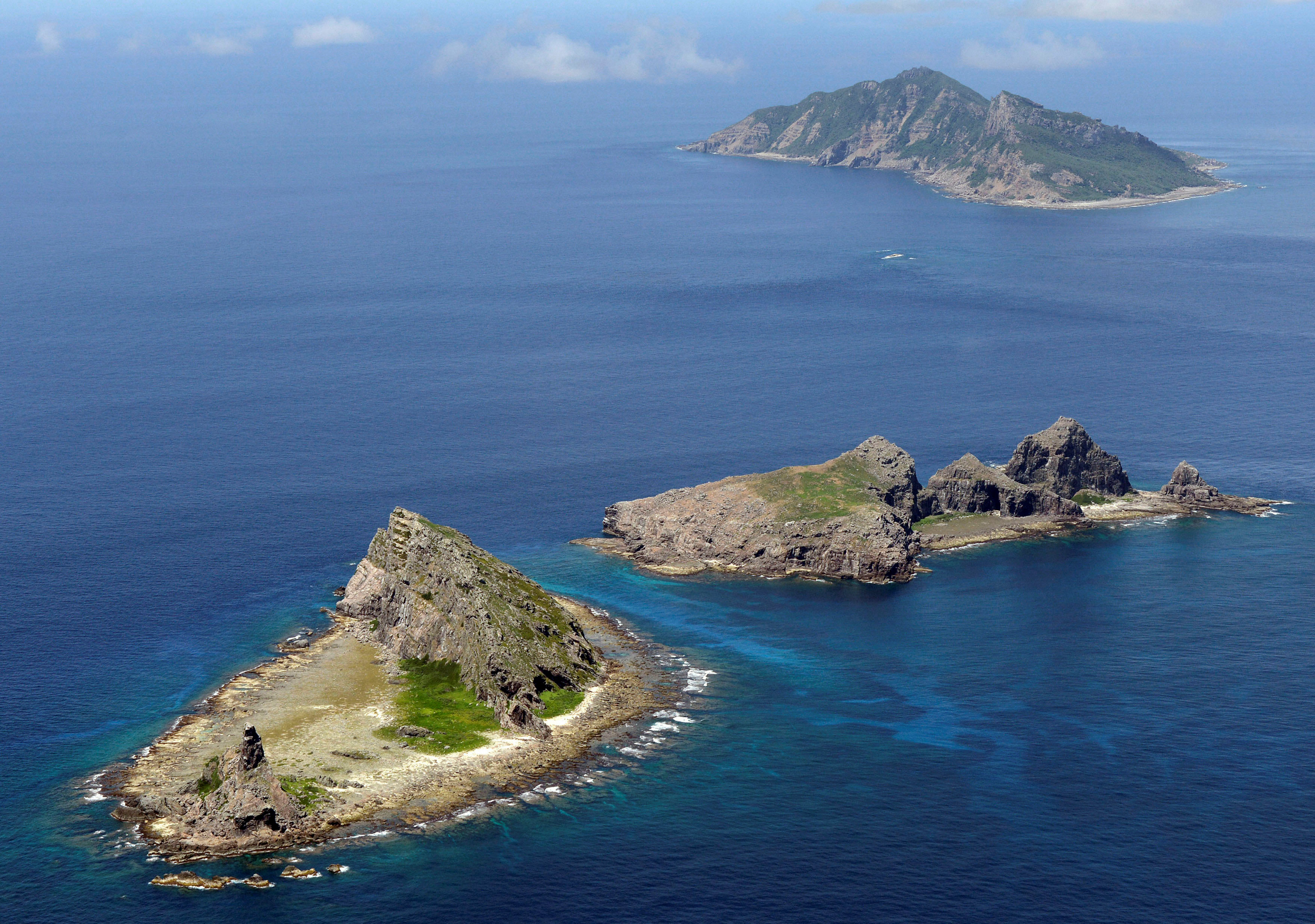 Japan protests after Chinese warship sails near disputed East China Sea islands