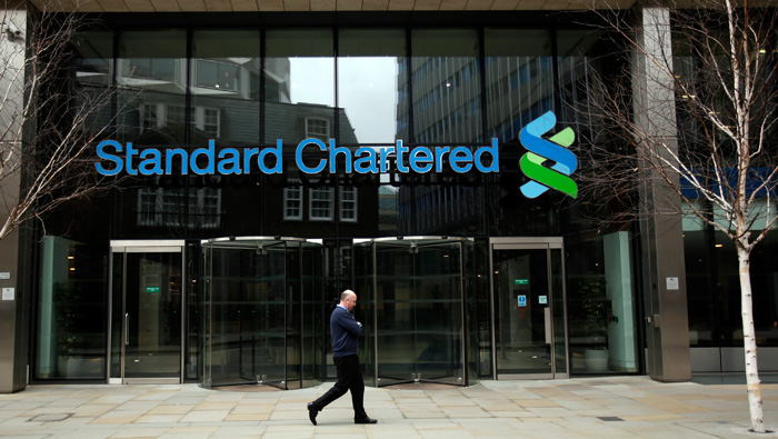 Standard Chartered profit falls 46% on revenue drop