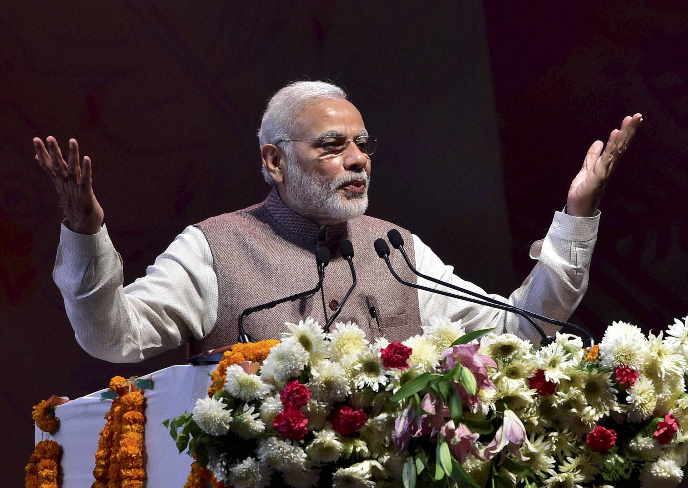 Modi warns of action against those who "snatch" tribal rights