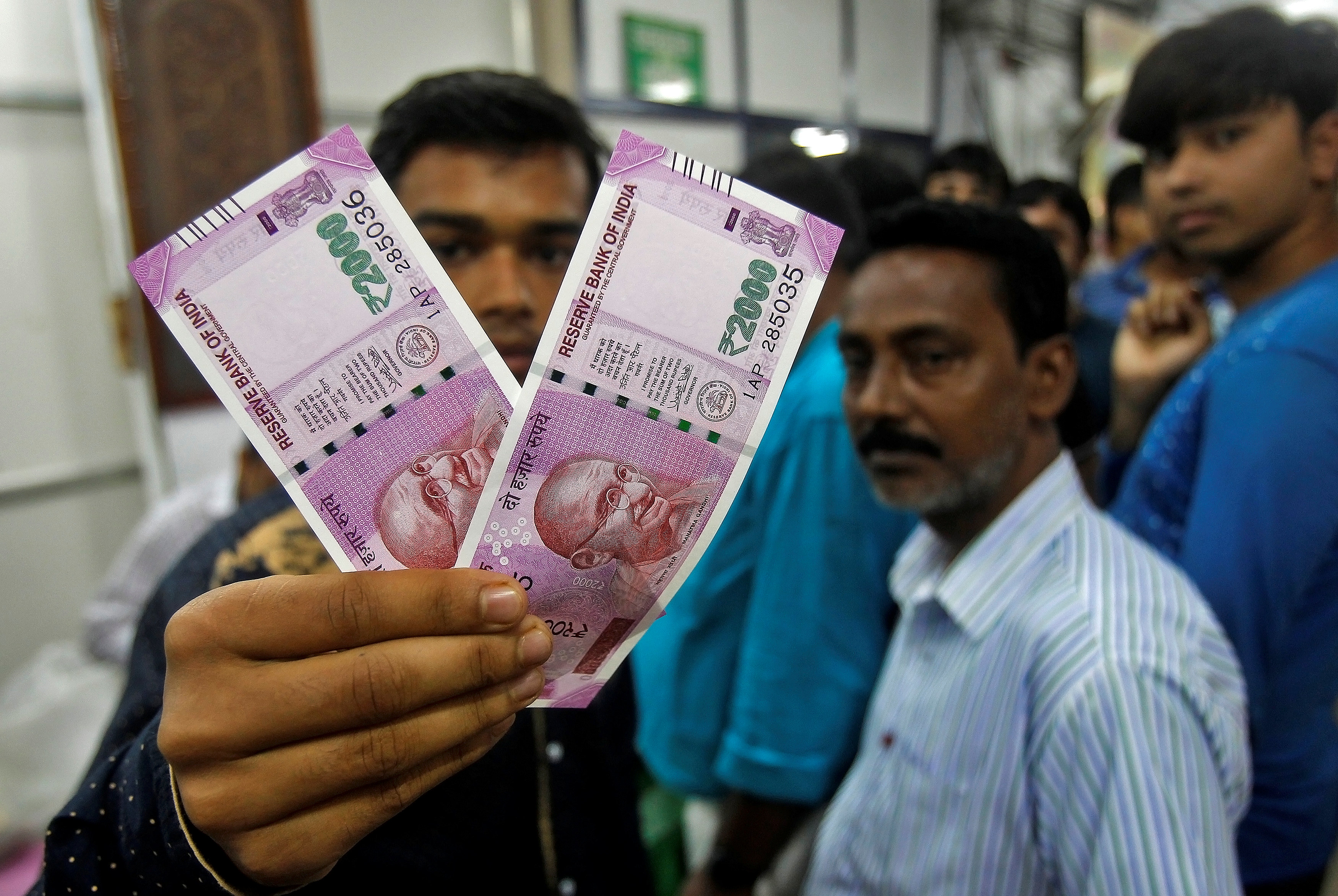 Chaos, long queues at banks in India; many ATMs still inactive