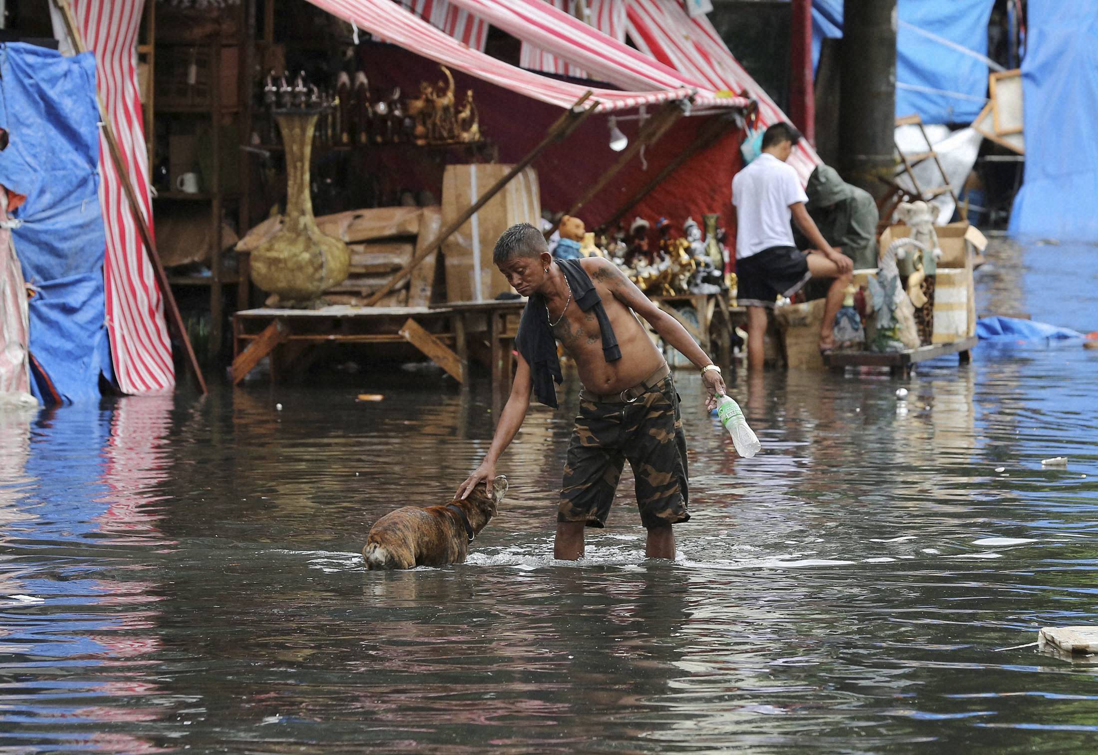 Typhoon eases but Philippines braces for floods, mudslides; 2 dead
