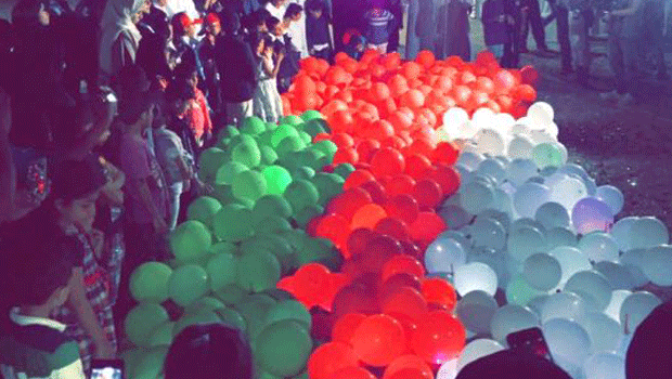 National Day: Omani flag made from balloons in Guinness bid