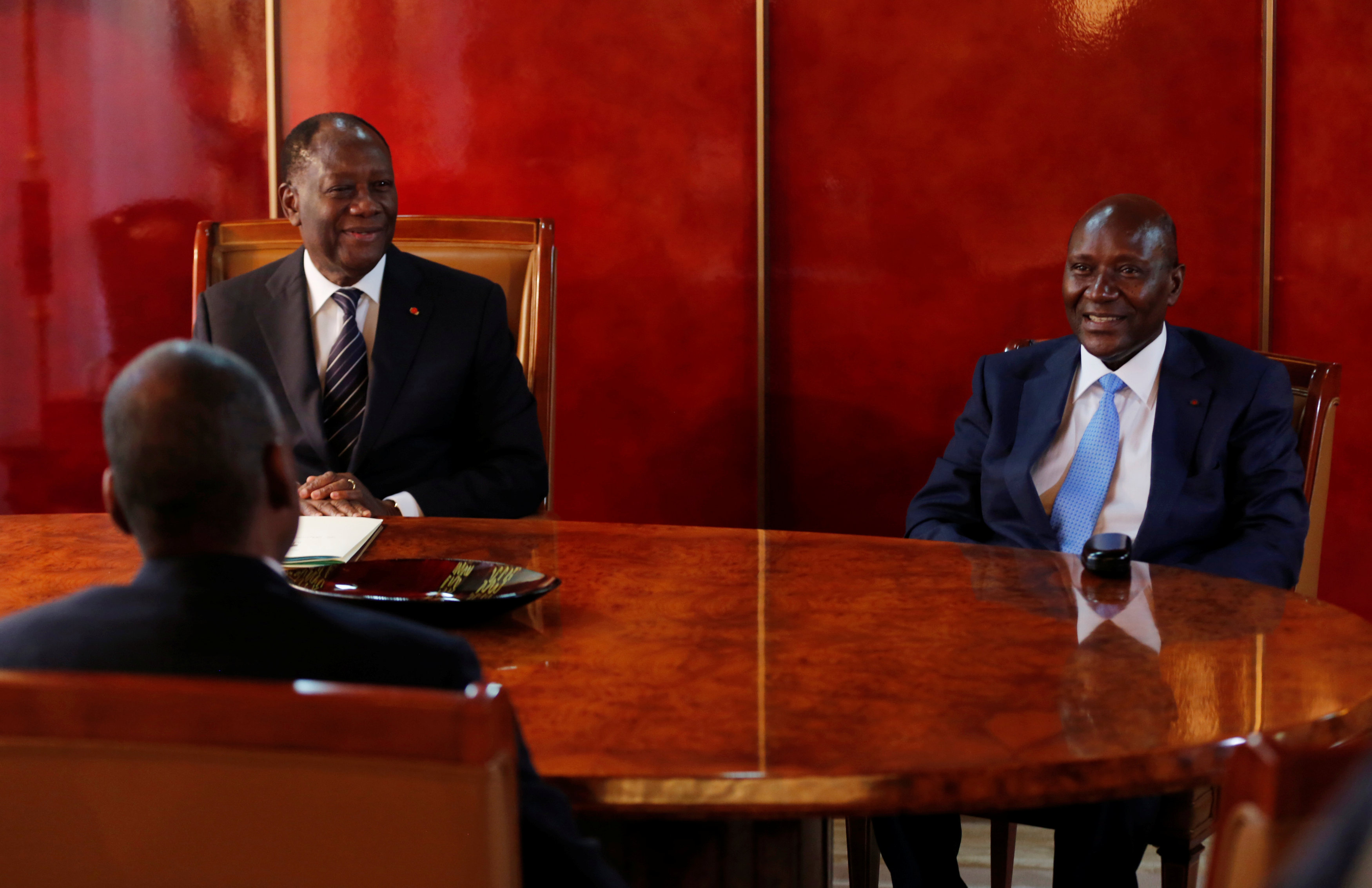 Ivory Coast's president slims down government in reshuffle