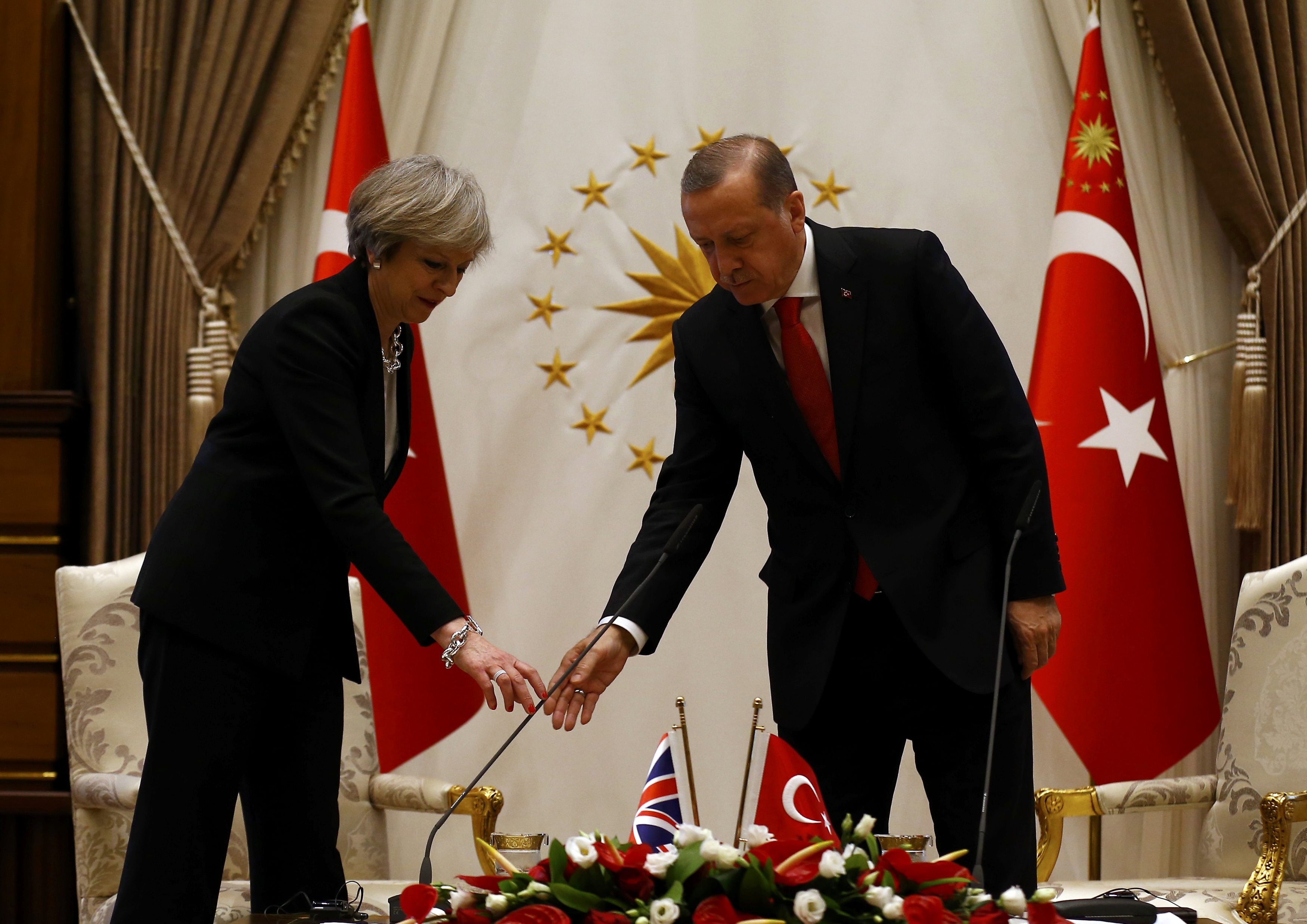 May calls on Turkey to maintain human rights after coup