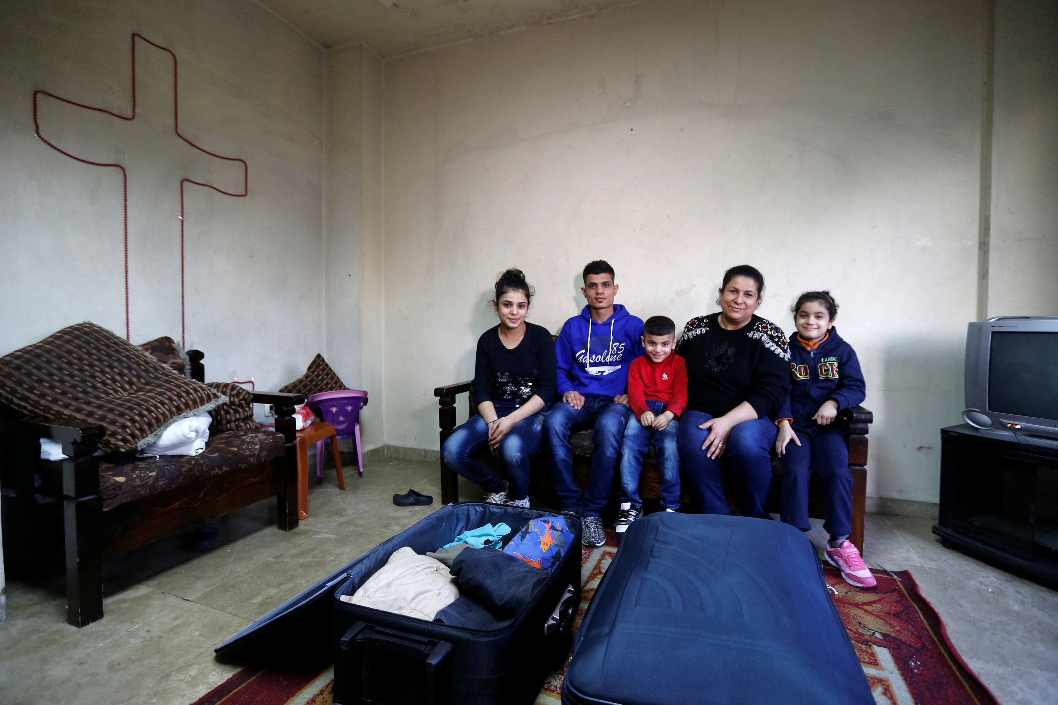 Driven from Iraq by IS, family struggles to make it to US
