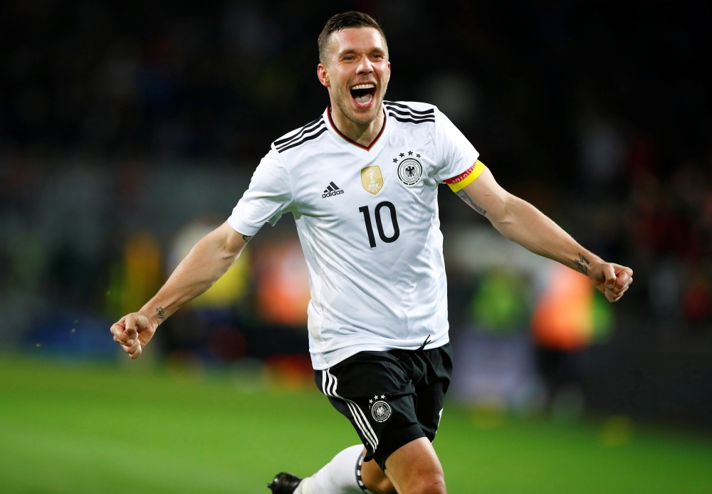 Football: Germany's Podolski crowns farewell with stunning winner over England