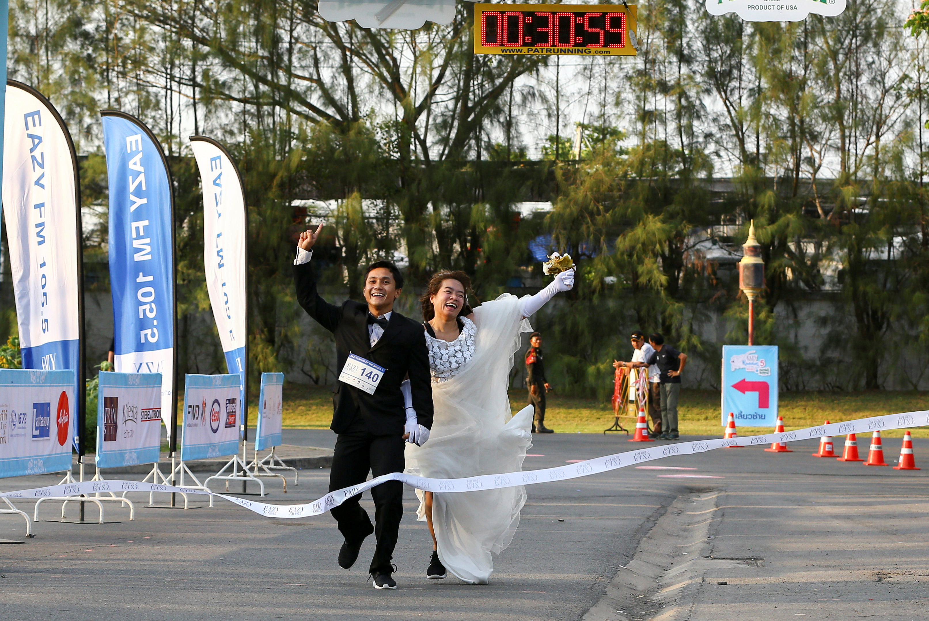 250 couples race in Thailand's 'Running of the Brides'