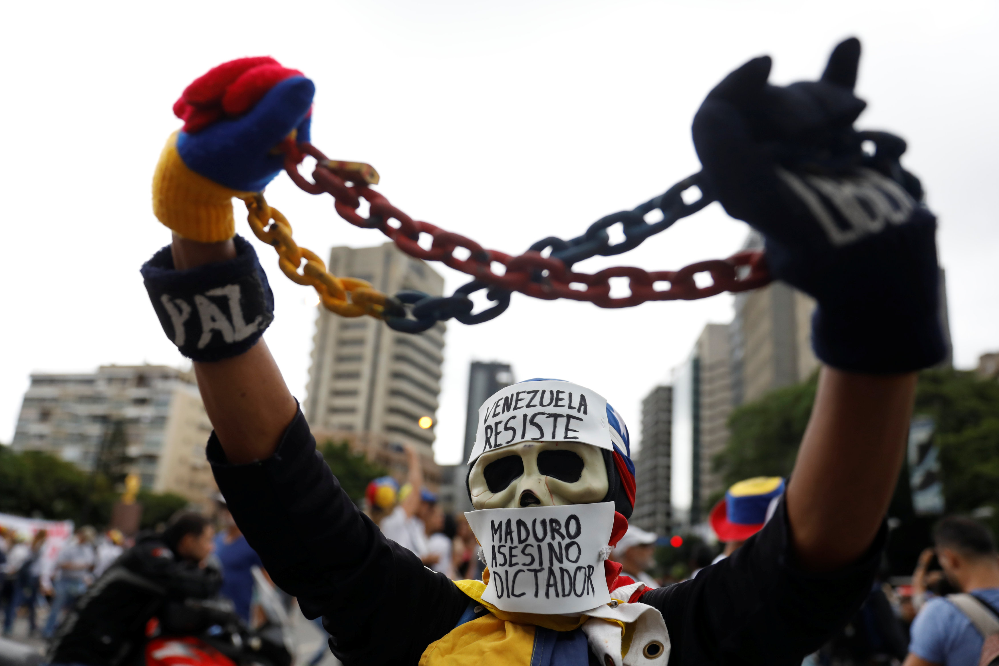 Venezuelan leader's foes, supporters hold rival May Day marches