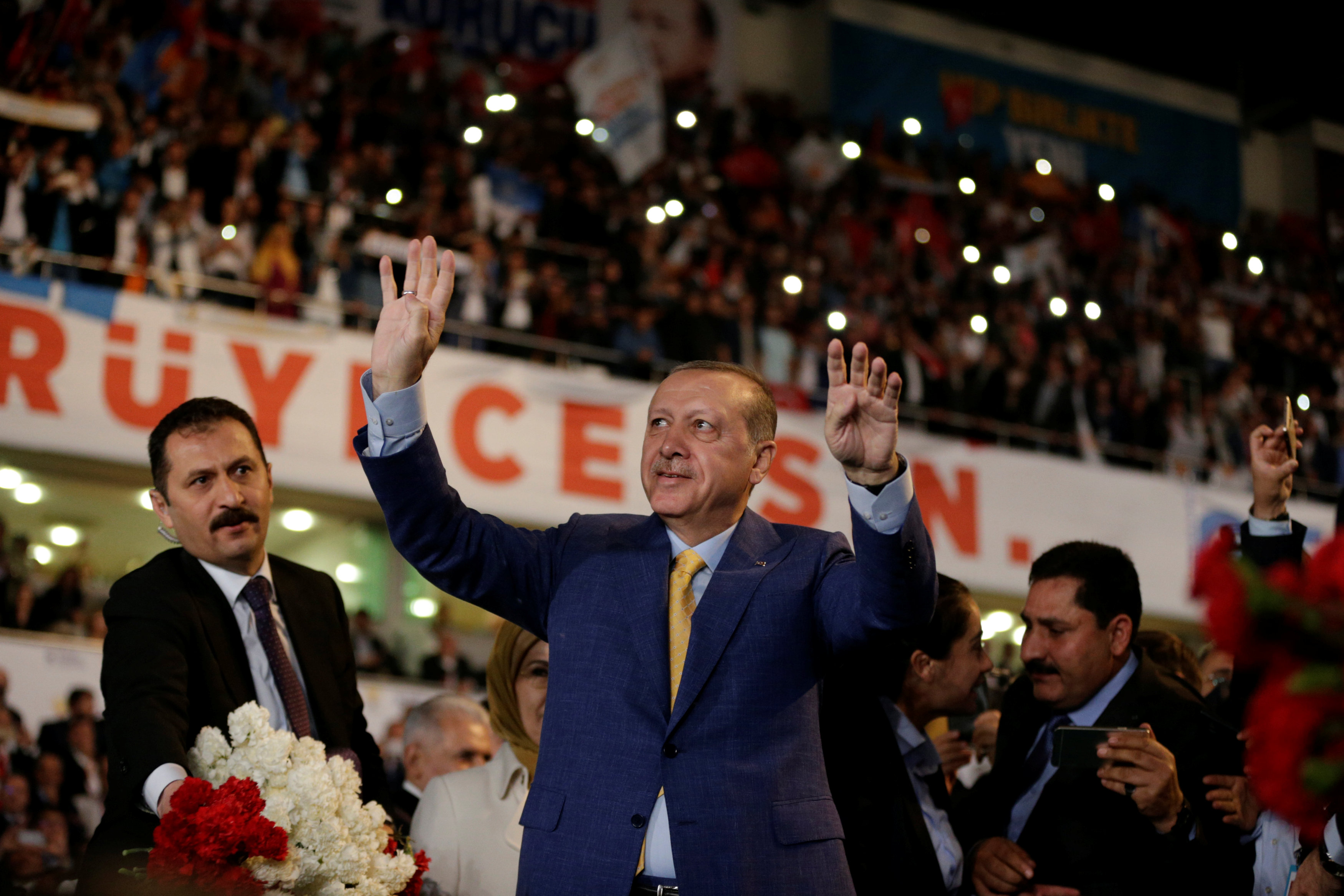 Turkey's Erdogan vows fight against enemies as returns to lead party