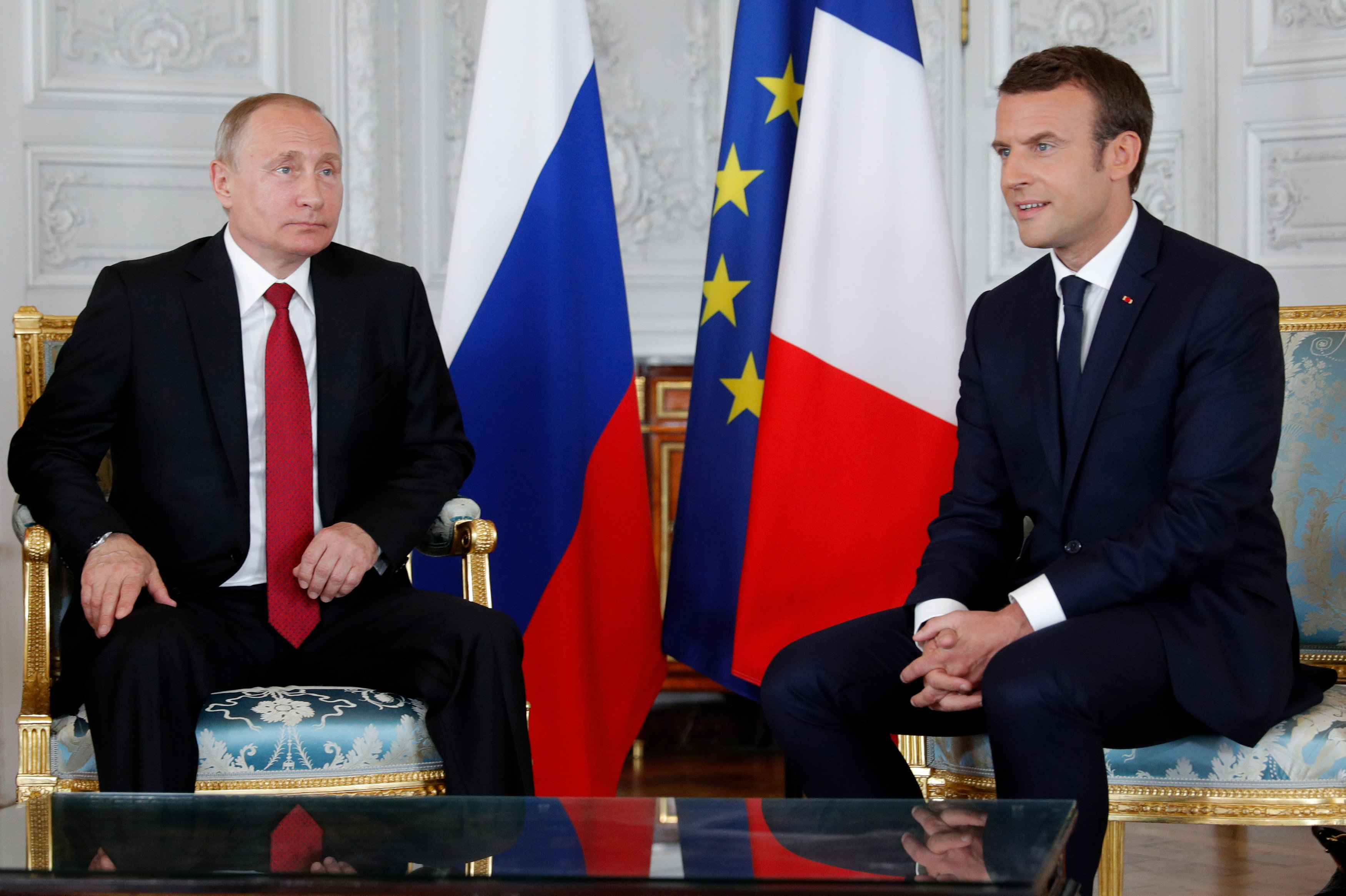 Macron, alongside Putin, denounces two Russian media for election meddling