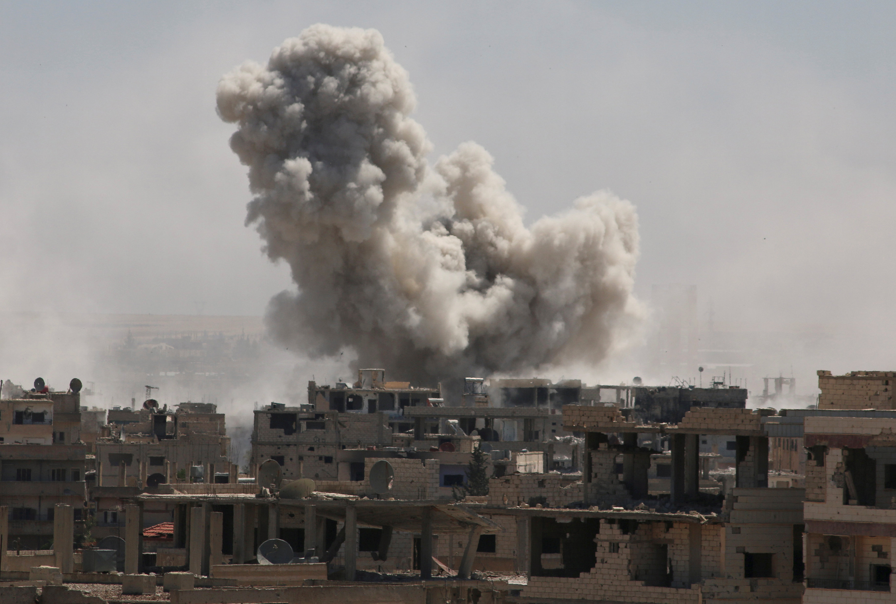 Syrian army and allies step up bombing of rebels in Deraa city