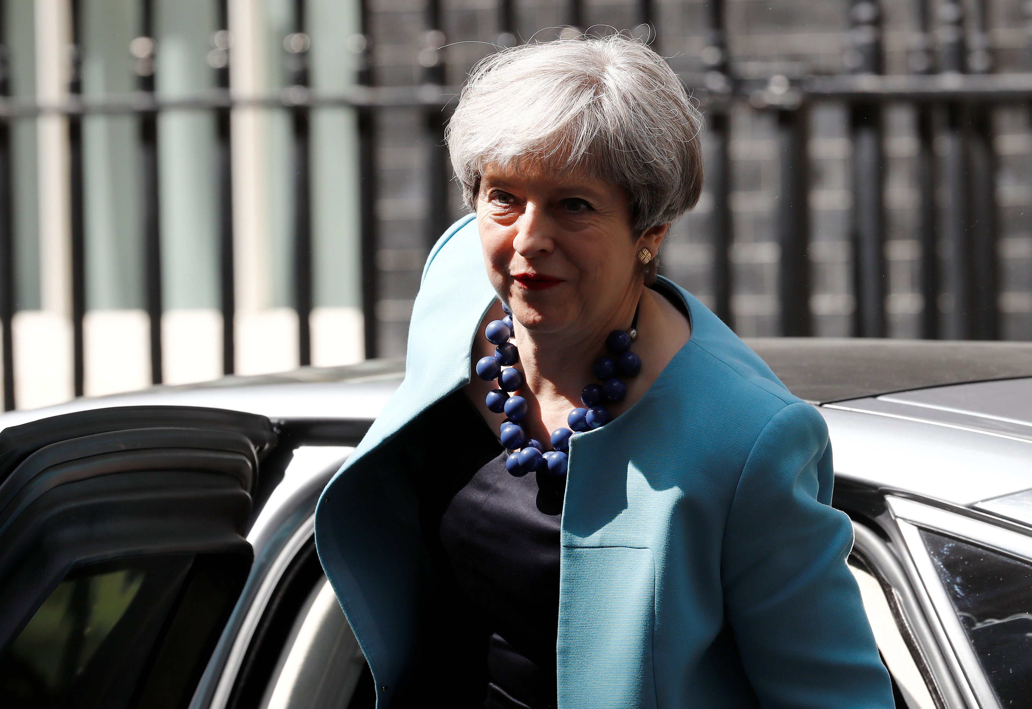 May inches toward deal to stay in power as battle rages over Brexit
