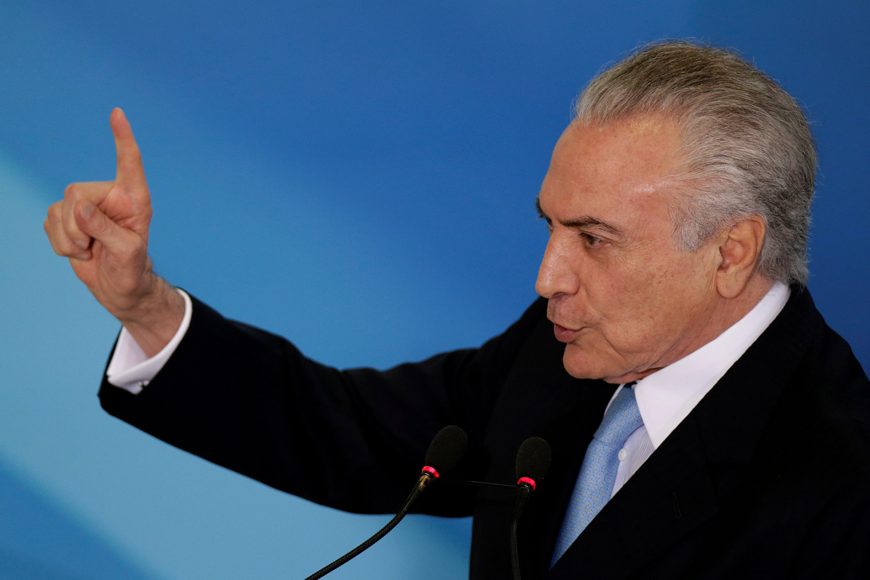Brazil's Temer to sue billionaire foe over graft accusations