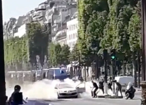 Car rams police van on Paris' Champs Elysees