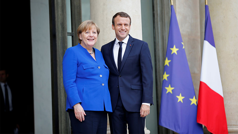 Macron urges greater euro zone convergence, presses Germany to act