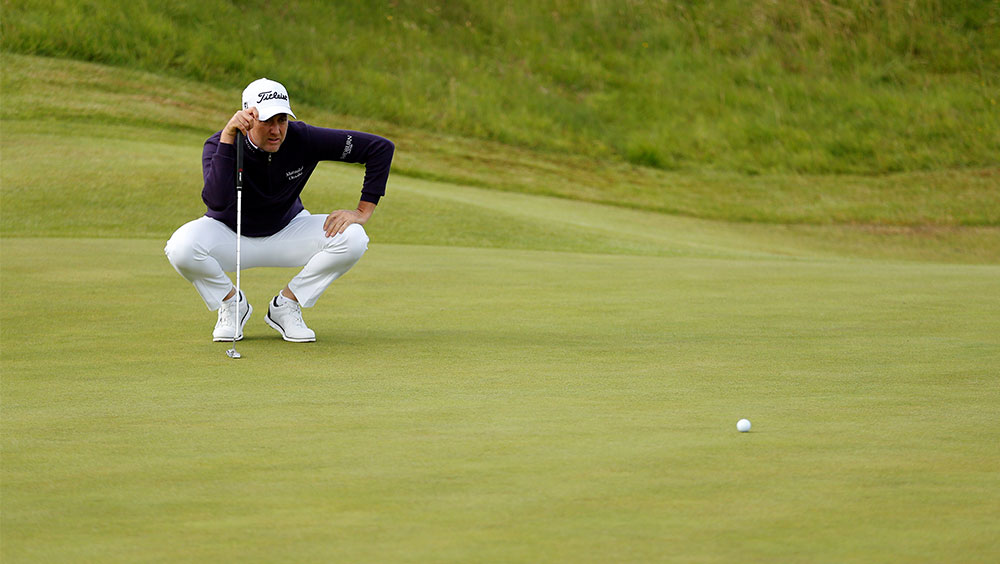 Golf: Poulter takes lead after early carnage at British Open