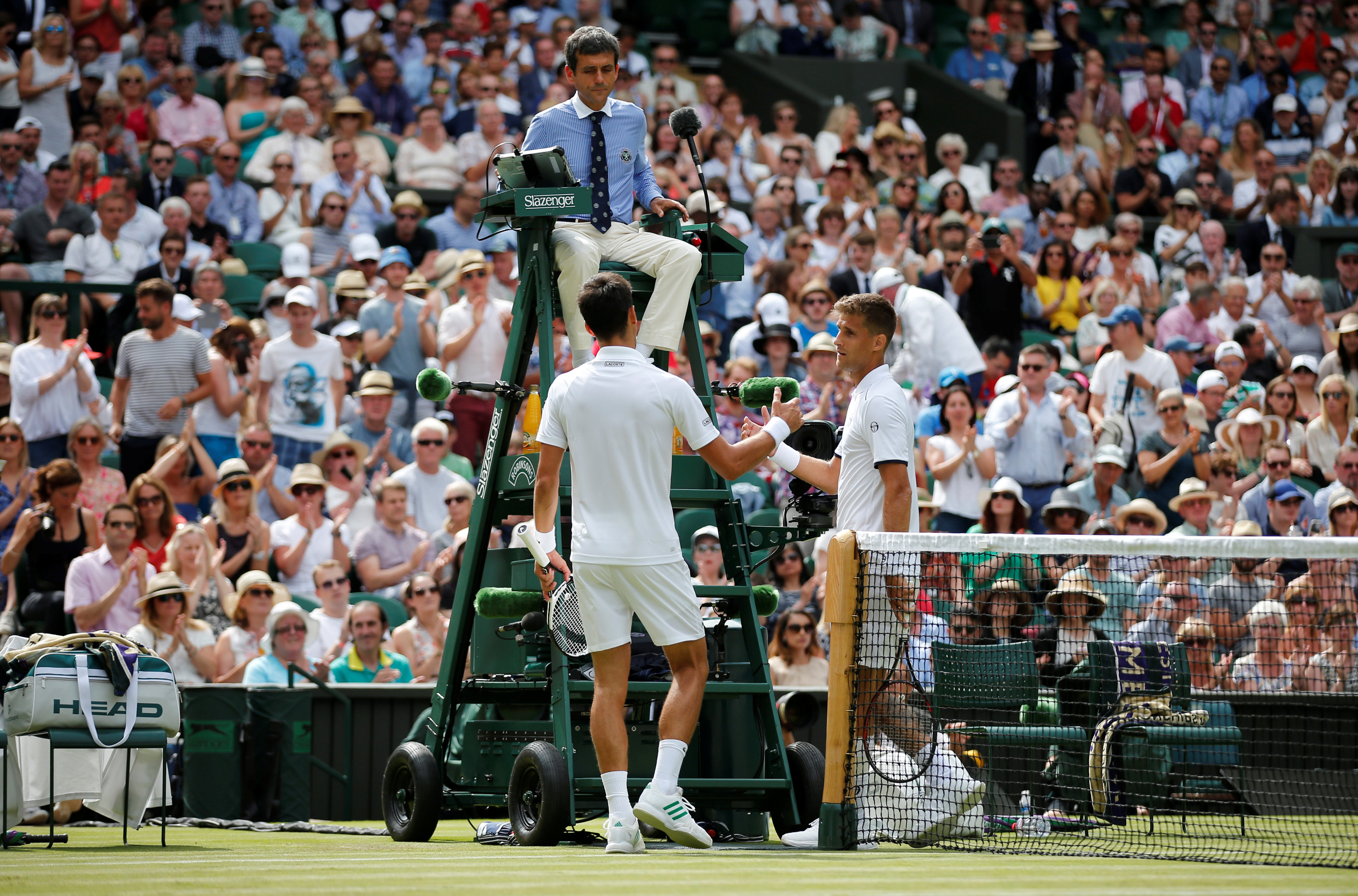 Tennis: Djokovic into second round of Wimbledon as Klizan retires injured