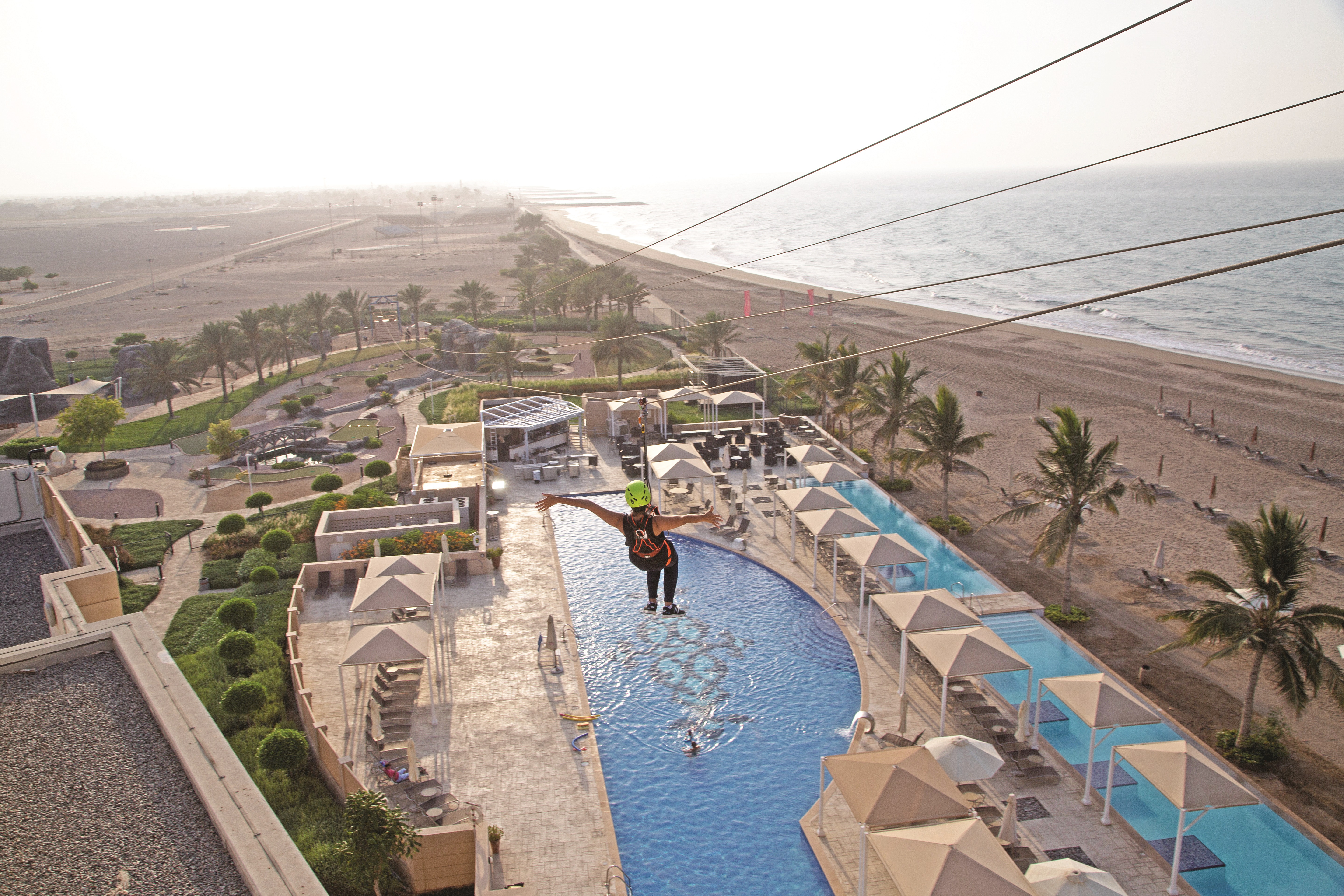 Try zip lining at Millennium Resort Mussanah in Oman
