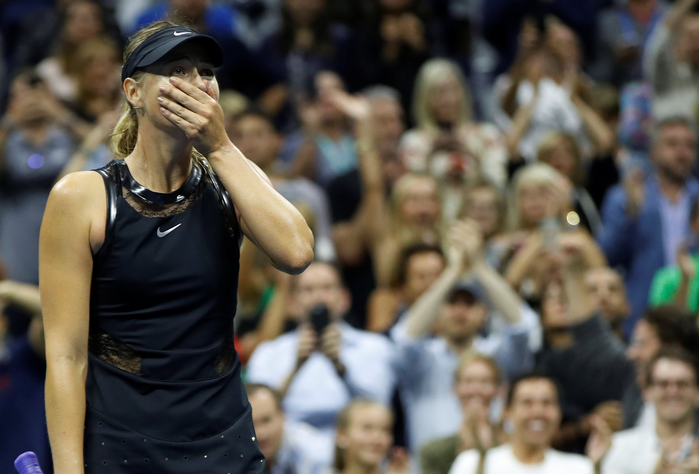 Tennis: Sharapova belies own doubts, back in New York spotlight