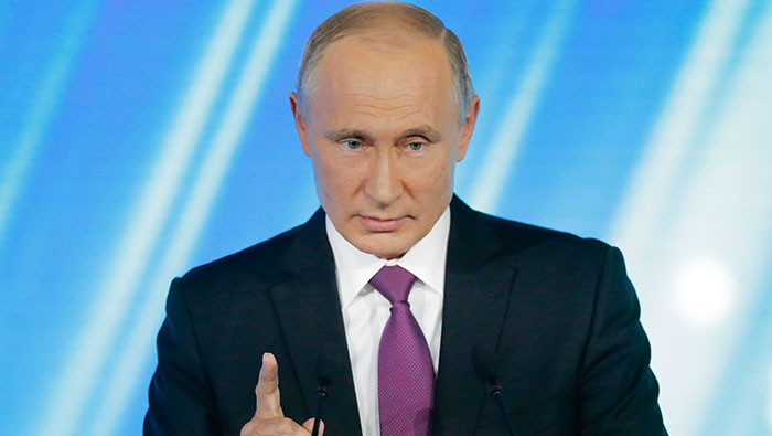 Putin dials up anti-U.S. rhetoric, keeps mum on re-election