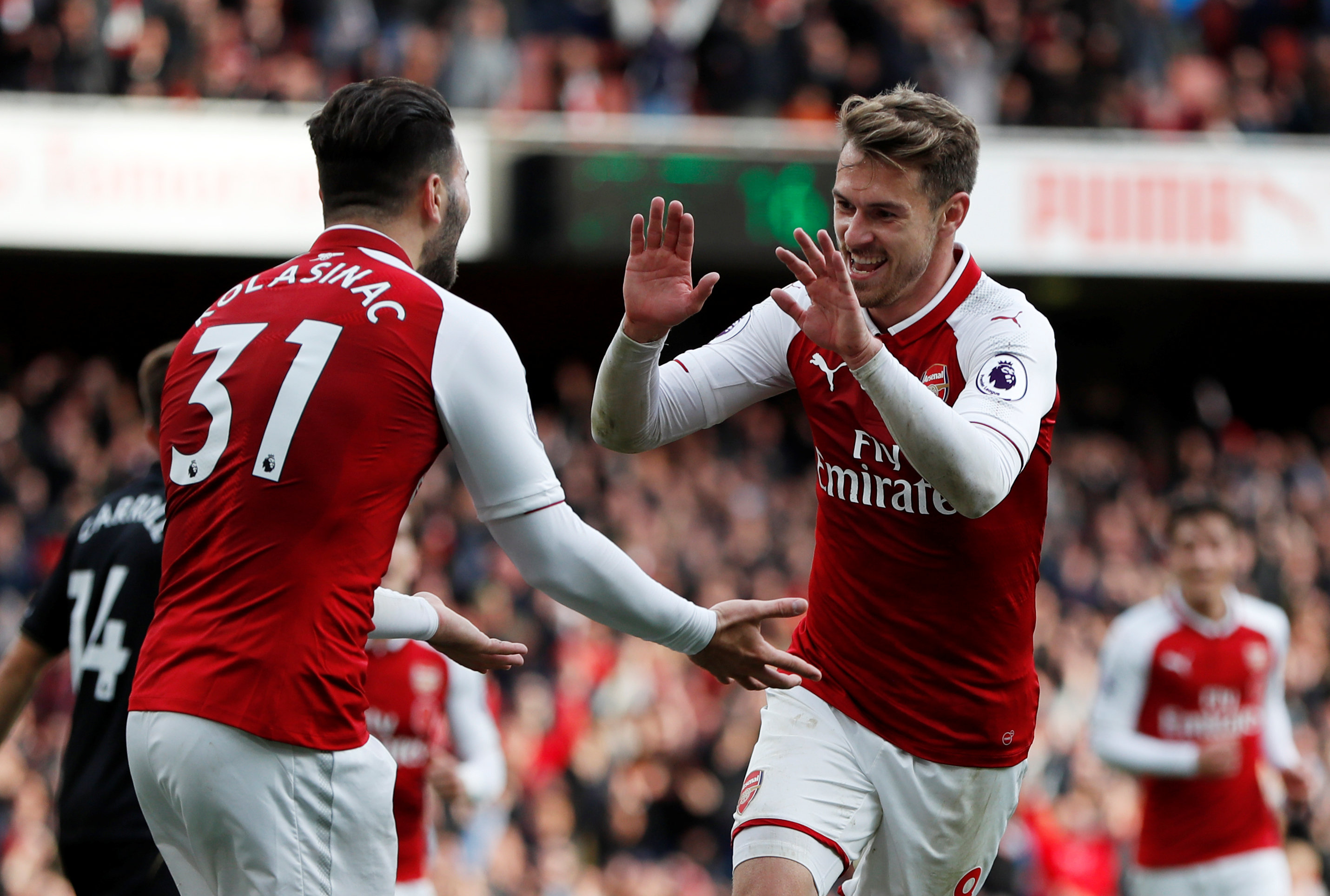 Football: Arsenal come from behind to beat Swansea 2-1