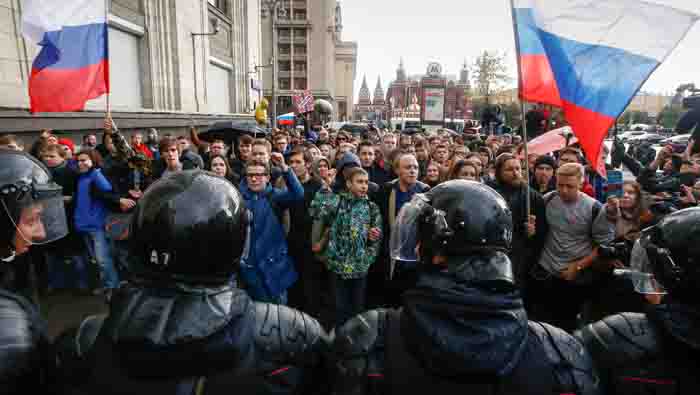 Opposition supporters rally across Russia, calling Putin to quit