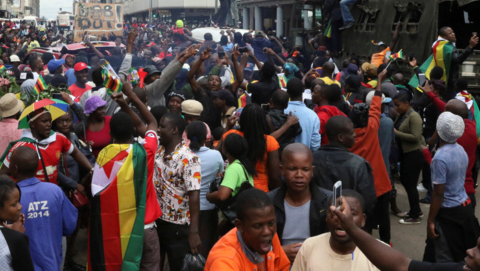 Party set to sack Mugabe, sources say, as Zimbabweans march on residence