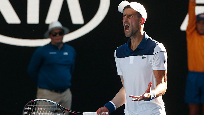 Djokovic survives Melbourne furnace to beat Monfils in Australian Open