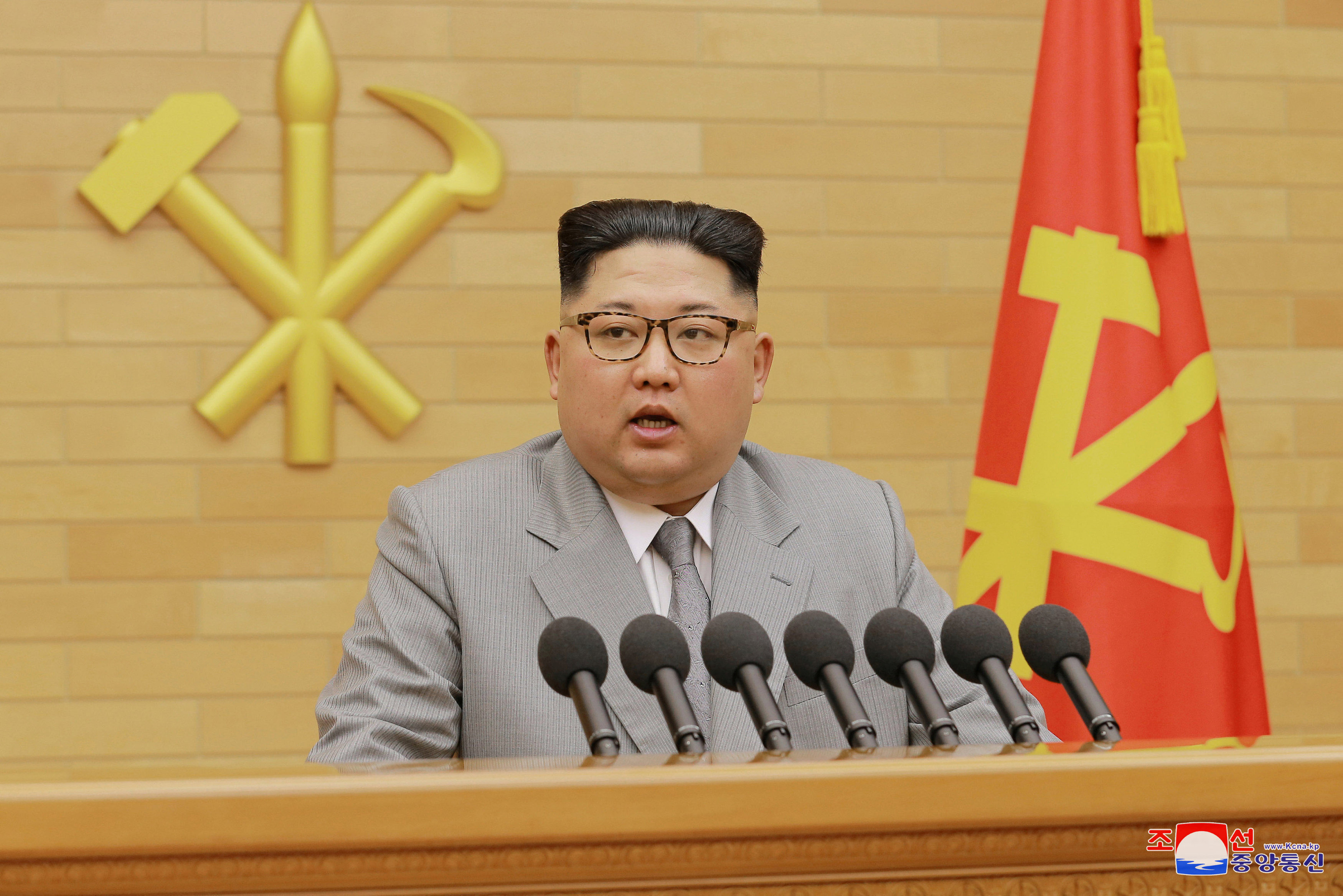 Kim goes for softer image in New Year address