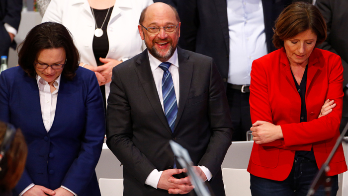 German SPD votes for coalition talks with Merkel