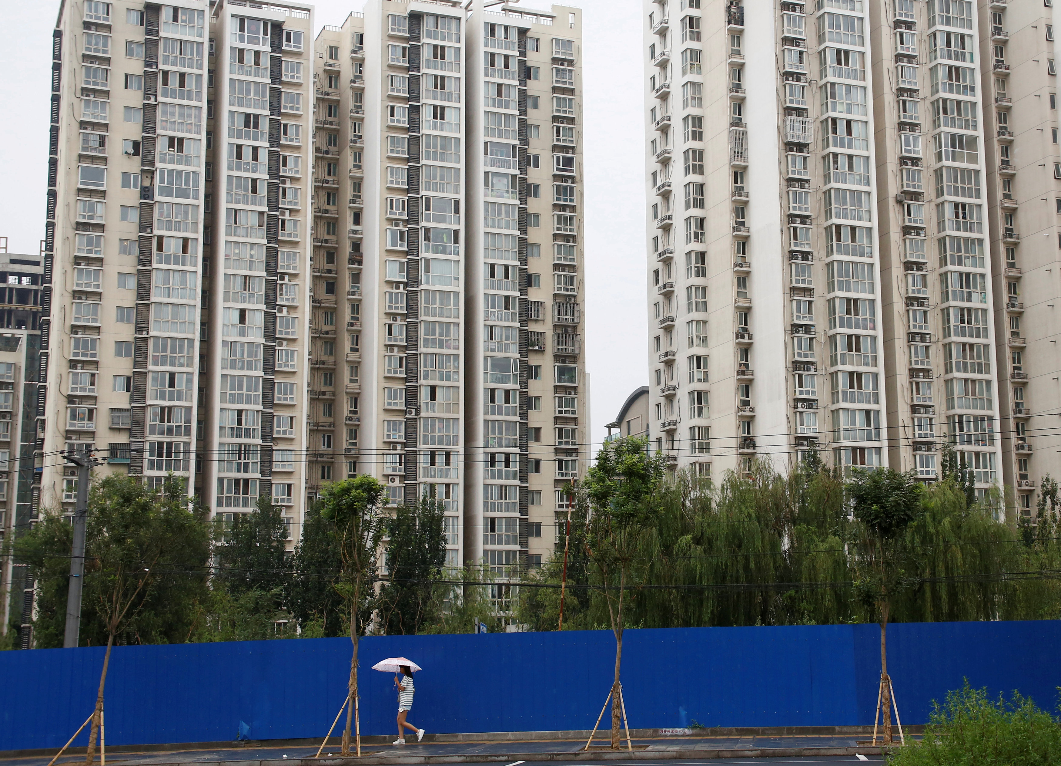 Chinese cities' moves to ease residency curbs fuel property demand