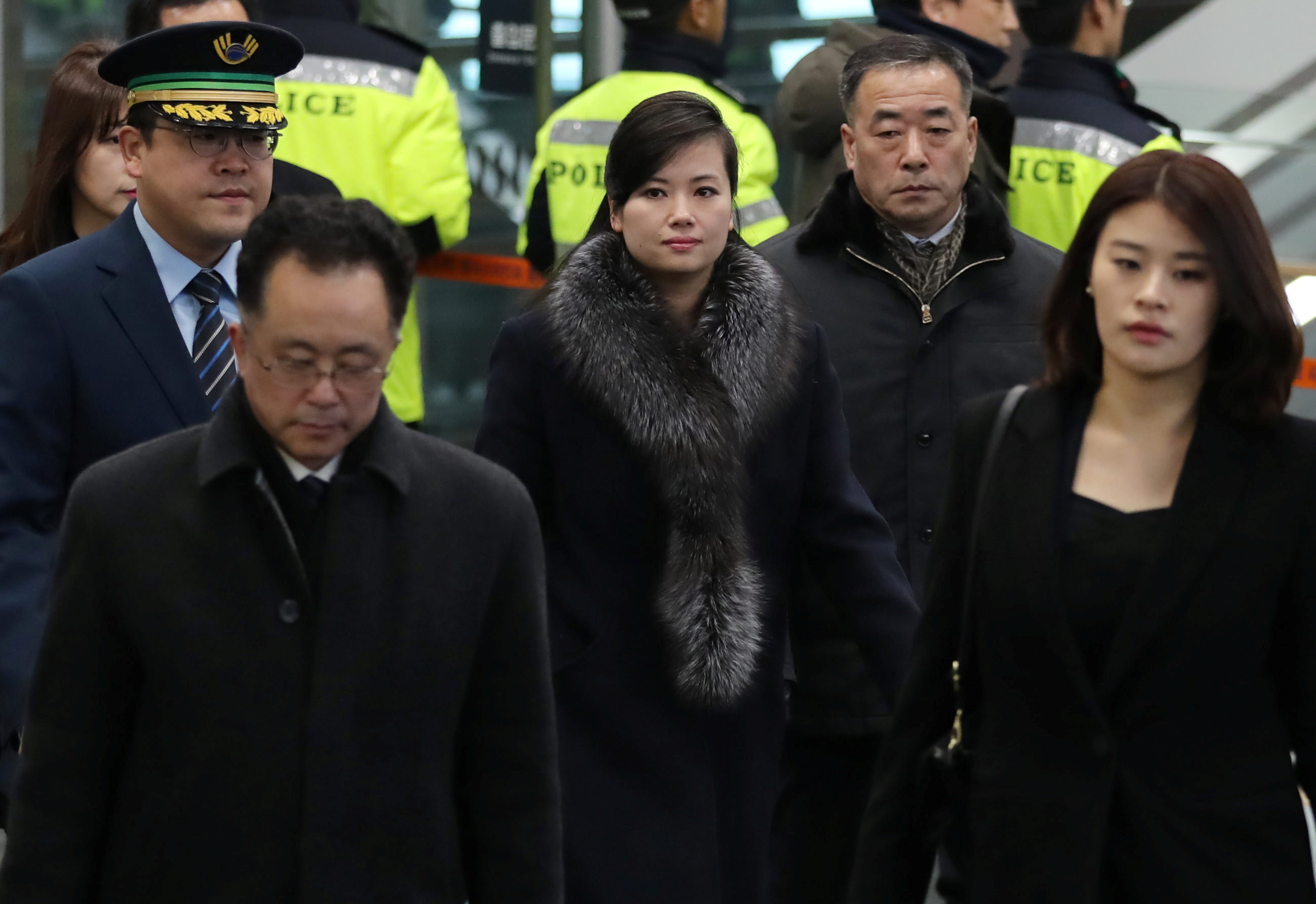 Demonstrators greet North Korean Olympic delegation touring Seoul