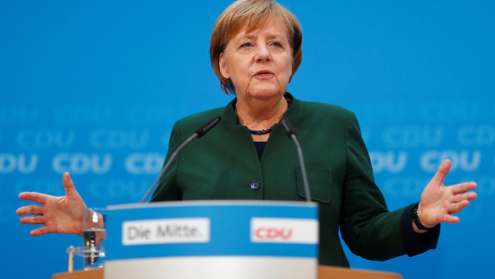 Merkel defends painful coalition concessions, denies authority waning