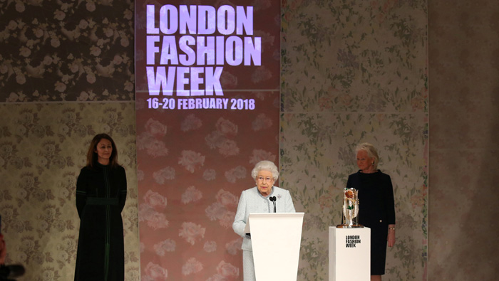 Queen Elizabeth makes surprise appearance at London fashion catwalk