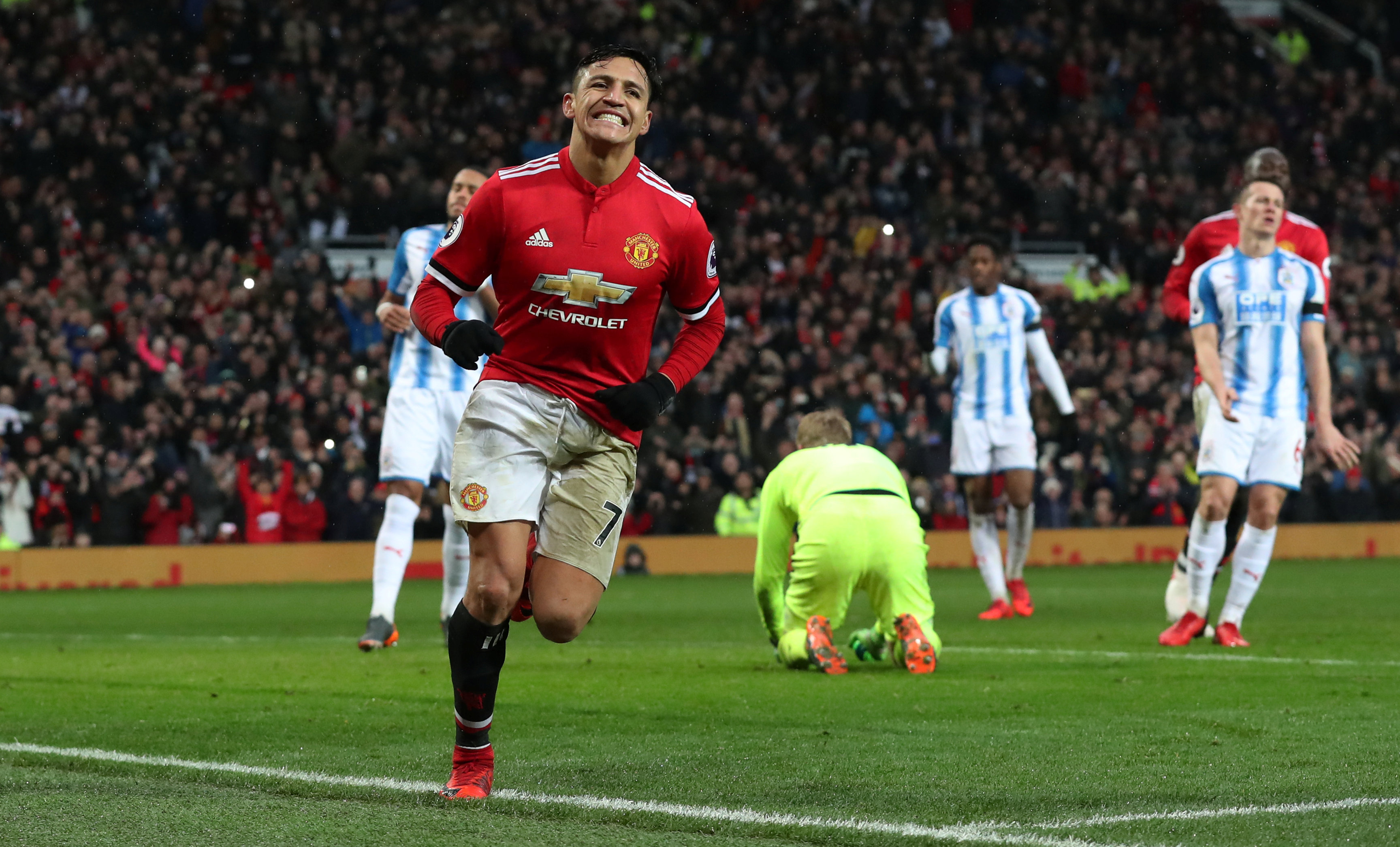 Football: Sanchez on target as United beat Huddersfield