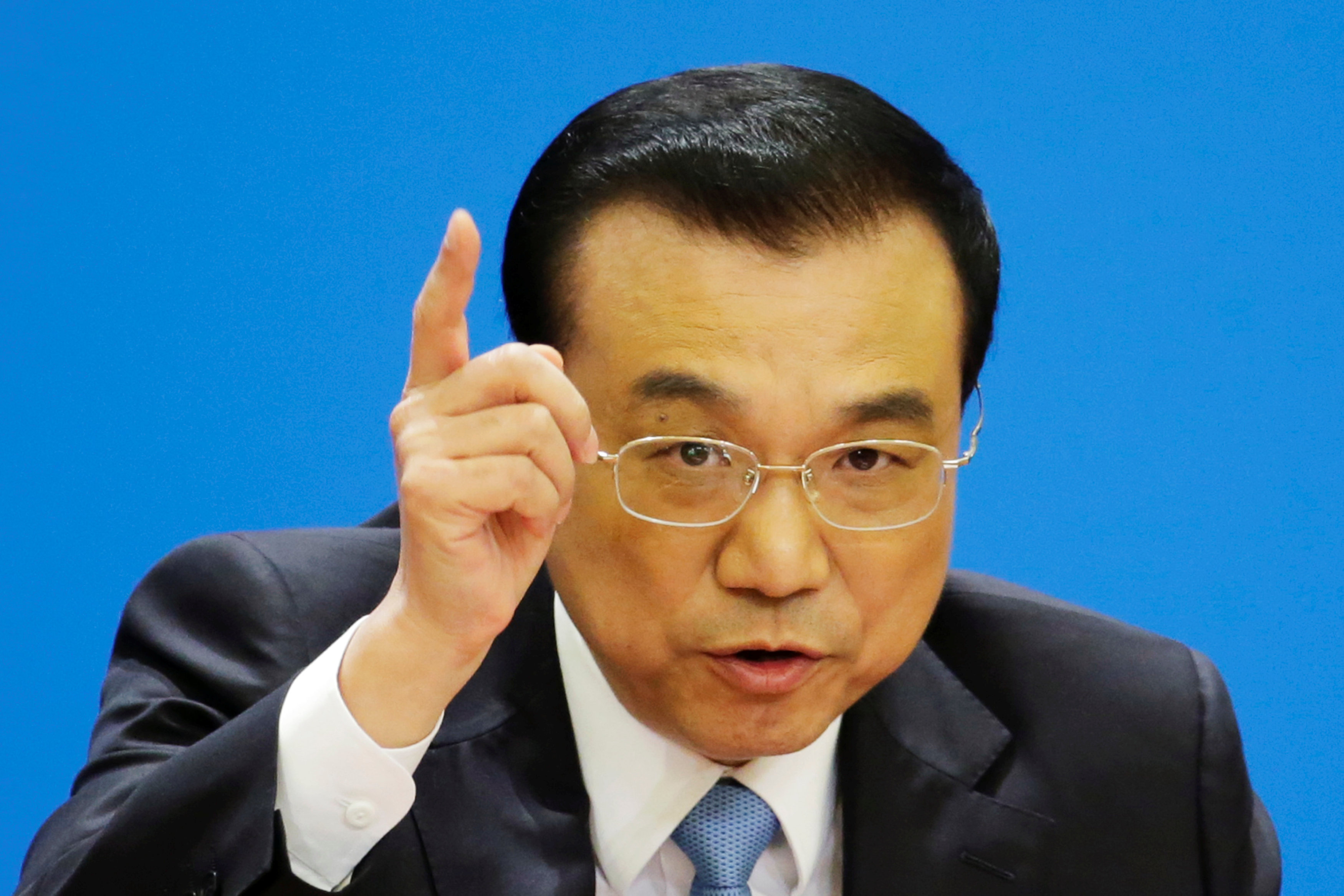 China's premier pledges further market opening