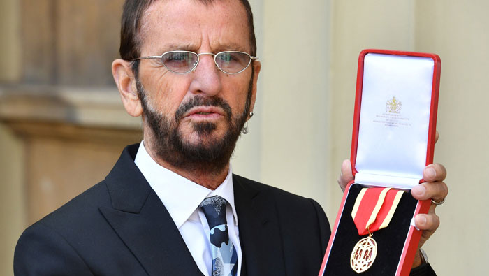 Beatles drummer Ringo Starr knighted at Buckingham Palace