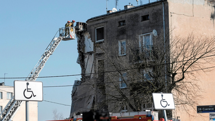 Four die in building collapse after explosion in Poland