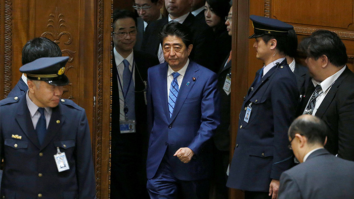 Japan's Abe sticks to denials as scandal doubts keep swirling