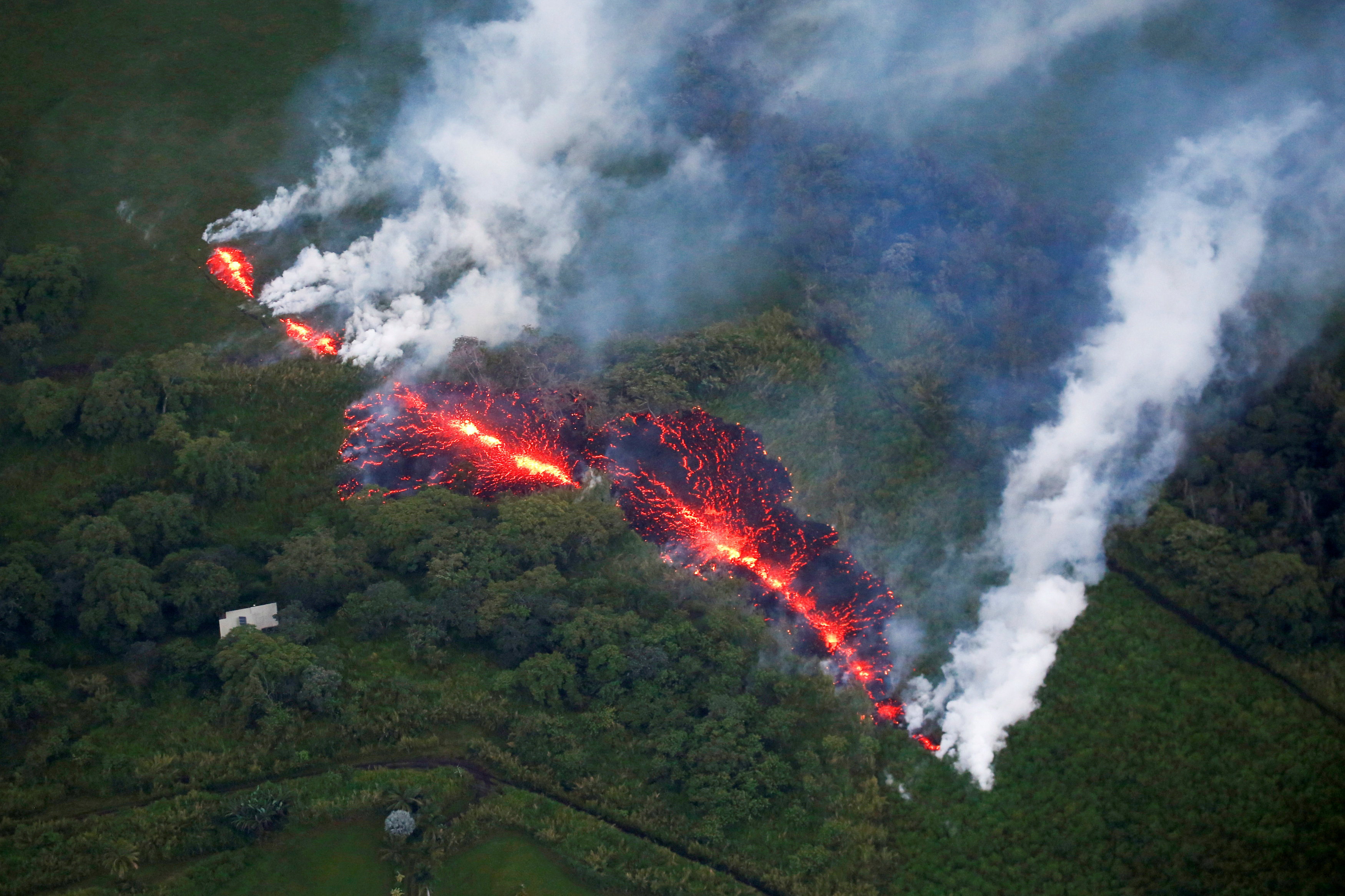 New fissures on Hawaiian volcano hurl bursts of rock, magma