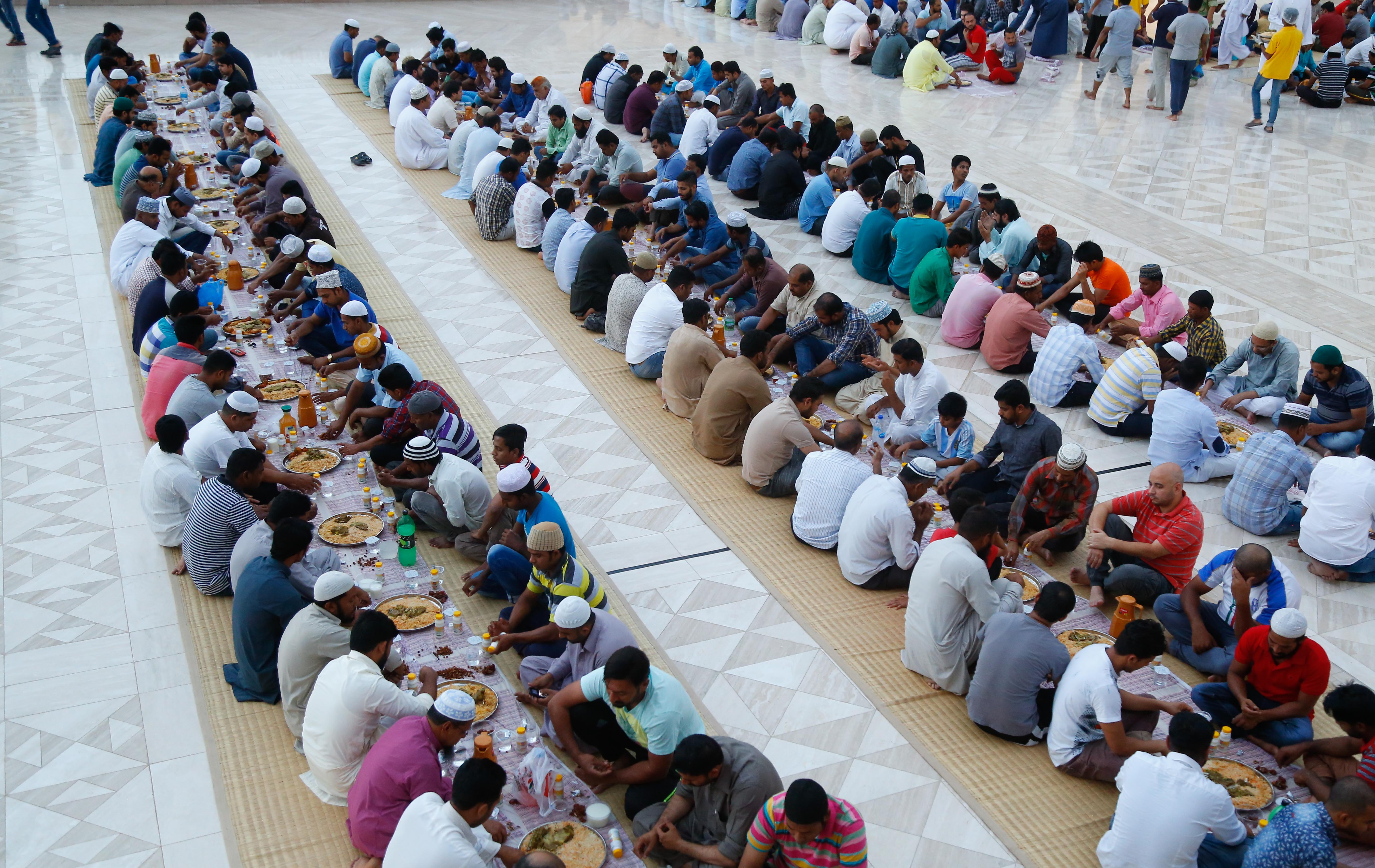 In pictures: People break their Ramadan fast at the Sultan Qaboos Grand Mosque
