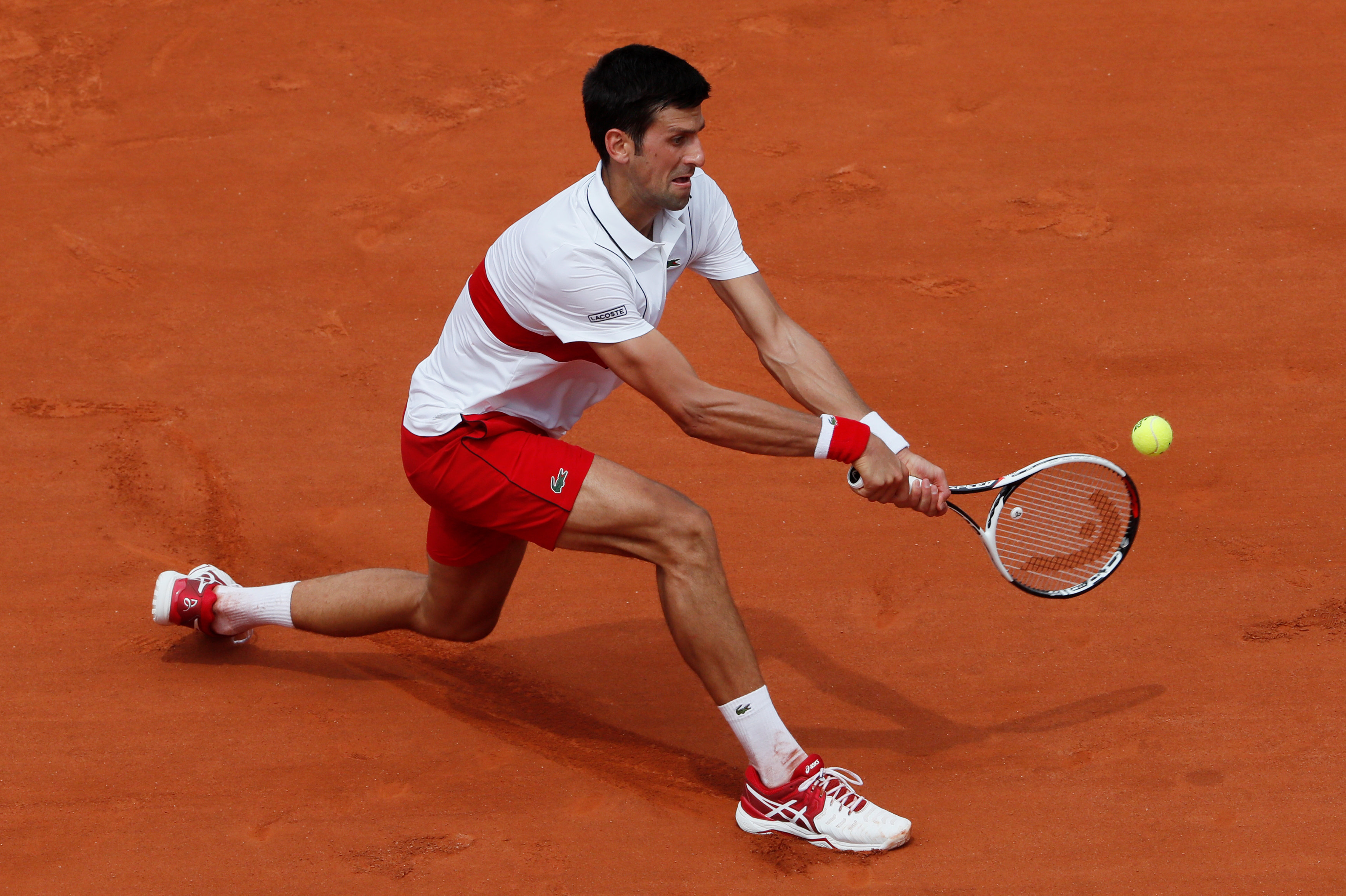 Djokovic begins campaign with moody victory