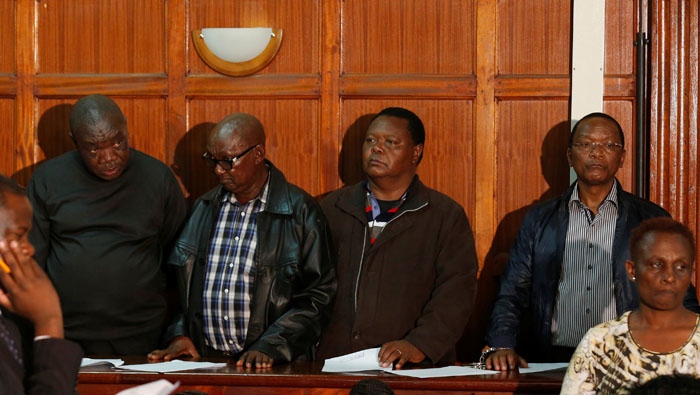 Kenya civil servants brought to court in handcuffs to face theft charges