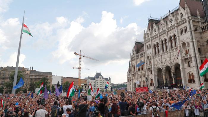 Hungarian parliament reconvenes, protesters rally against PM Orban